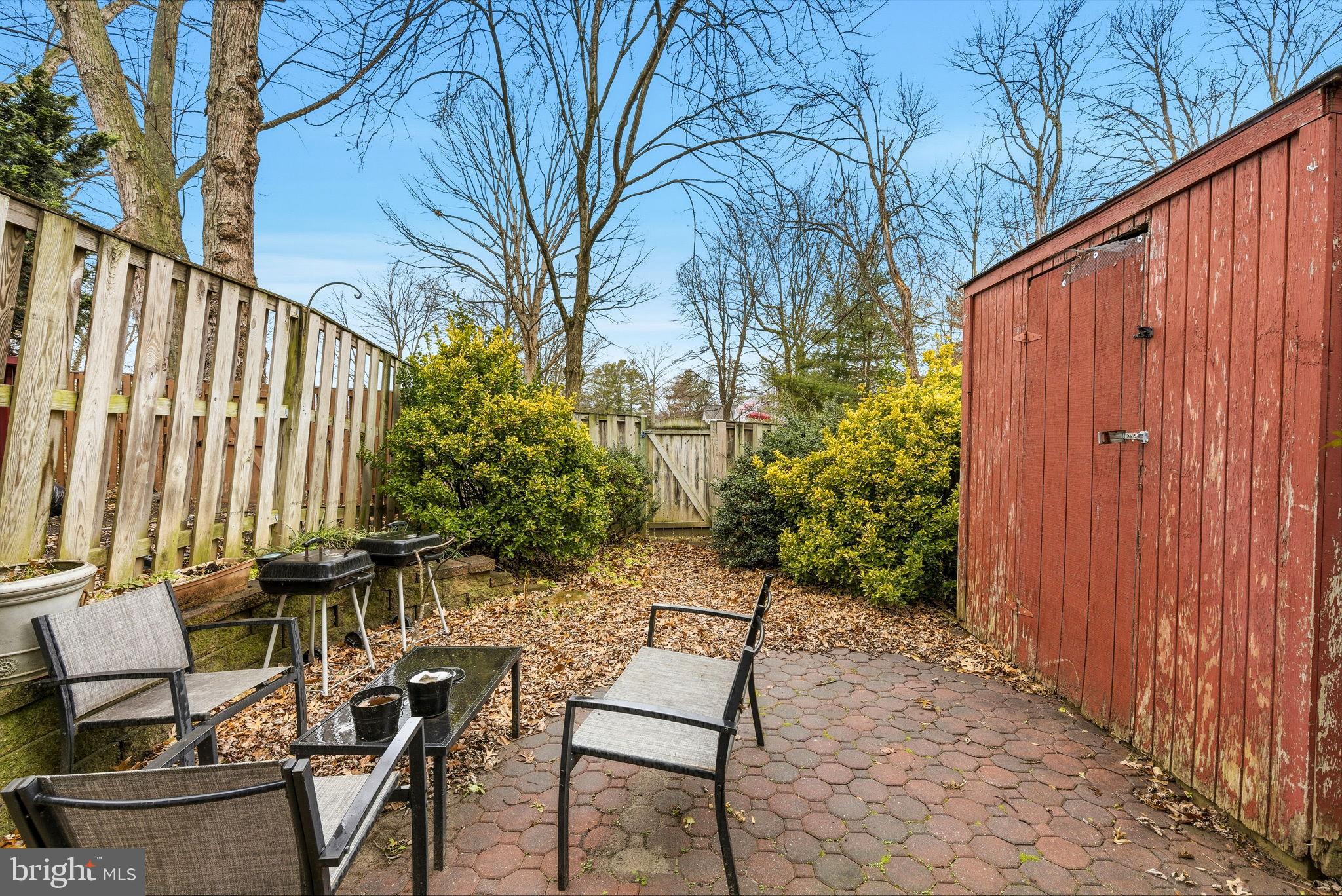 11072 Berrypick Lane Columbia, MD 21044 - Photo 32 of 35 a backyard of a house with table and chairs