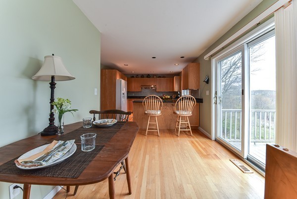 14 Farm Hill Road Natick, MA 01760 - Photo 11 of 27 a dining room with furniture a large window and wooden floor