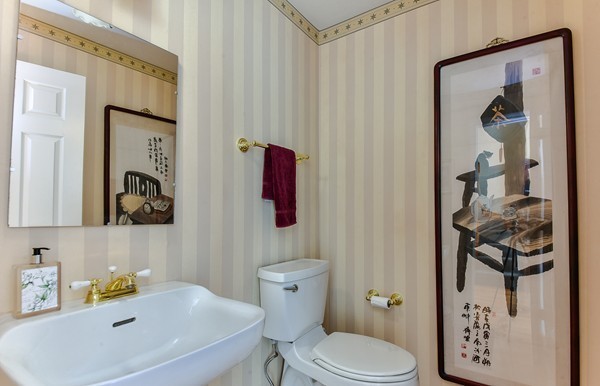 14 Farm Hill Road Natick, MA 01760 - Photo 7 of 27 a bathroom with a sink a toilet and a mirror