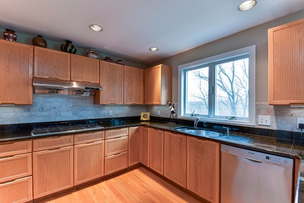 14 Farm Hill Road Natick, MA 01760 - Photo 8 of 27 a kitchen with granite countertop wooden cabinets a sink and a window