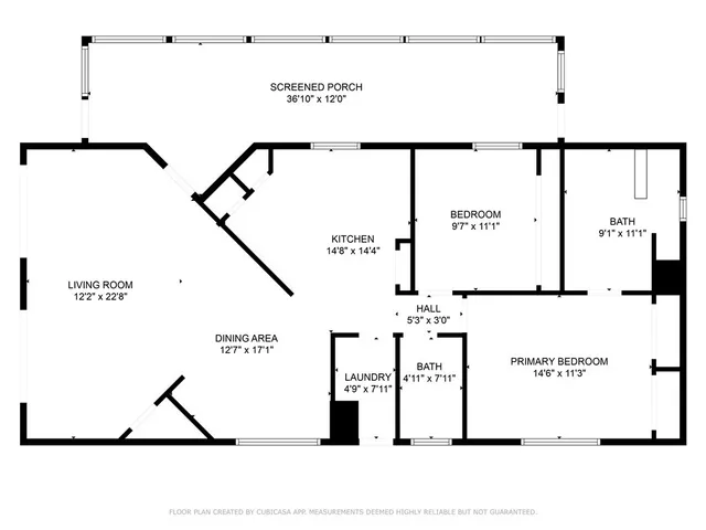 an aerial view of a house with a yard and mountain view