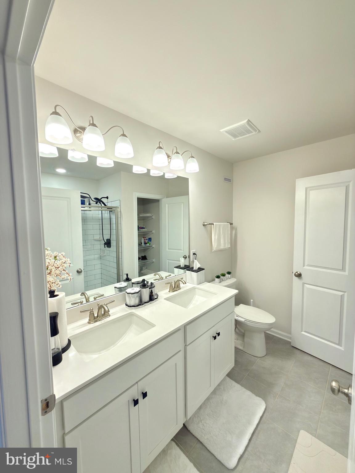 20 Stanton Rd Mount Mount Holly, NJ 08060 - Photo 16 of 25 a bathroom with a double vanity sink and a mirror