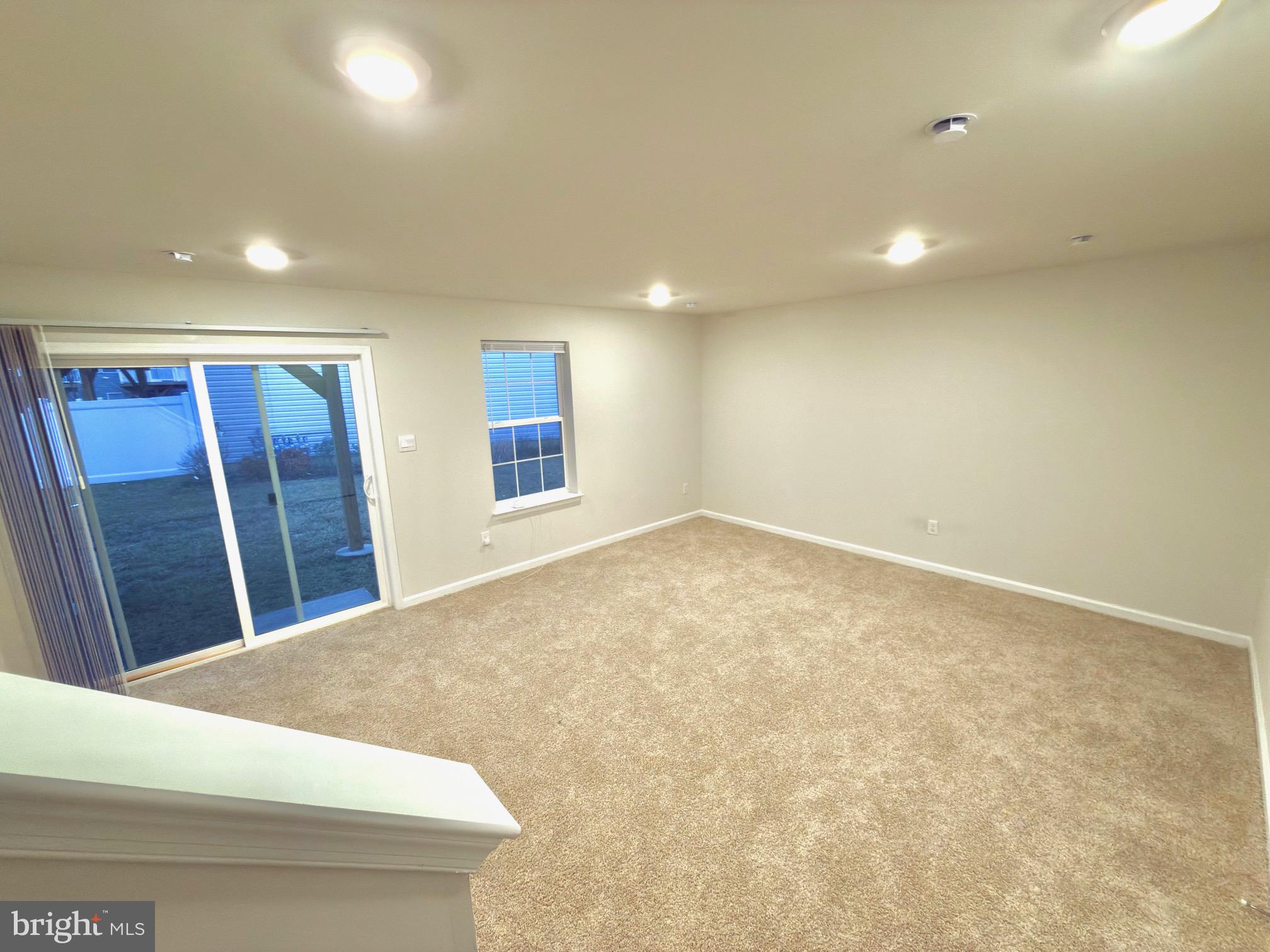 20 Stanton Rd Mount Mount Holly, NJ 08060 - Photo 6 of 25 a view of an empty room with wooden floor and a window