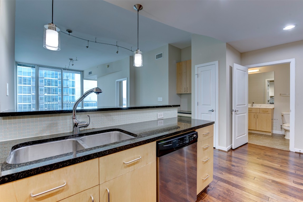 5925 Almeda Road, Unit 2214 Houston, TX 77004 - Photo 5 of 34 a kitchen with stainless steel appliances granite countertop a sink and a counter space