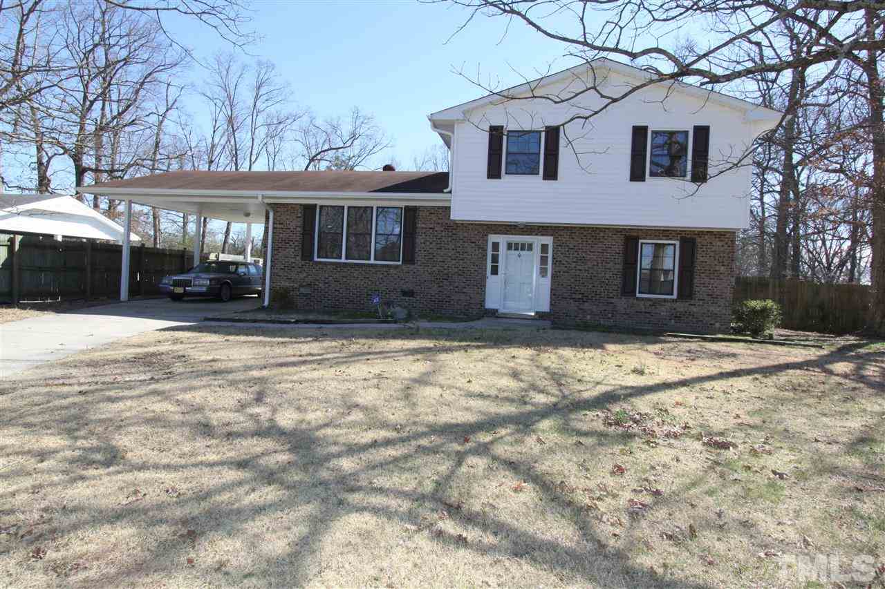 4120 Live Oak Road Raleigh, NC 27604 - Photo 1 of 25 a front view of a house with a yard covered in snow