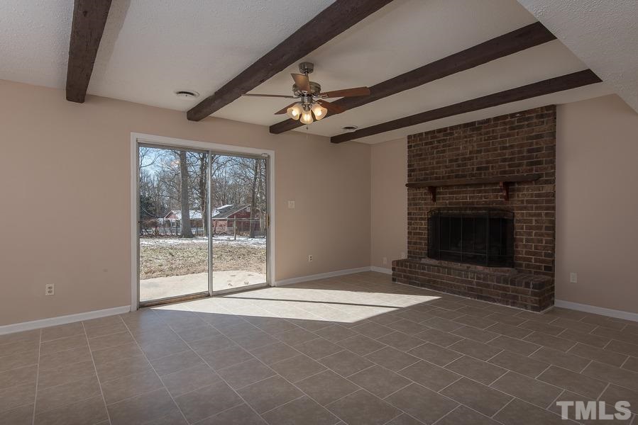 4120 Live Oak Road Raleigh, NC 27604 - Photo 14 of 25 a view of an empty room with windows and fireplace