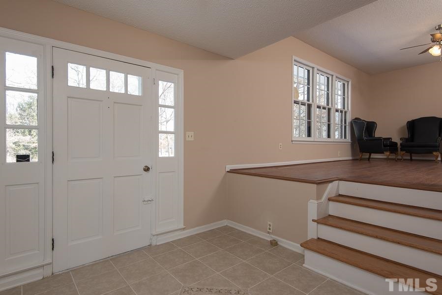 4120 Live Oak Road Raleigh, NC 27604 - Photo 4 of 25 a view of an empty room with windows & cabinet