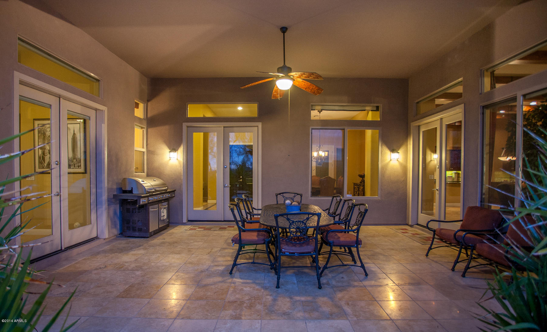 1819 West Red Fox Road Phoenix, AZ 85085 - Photo 34 of 56 Back Yard Covered Patio Twilight