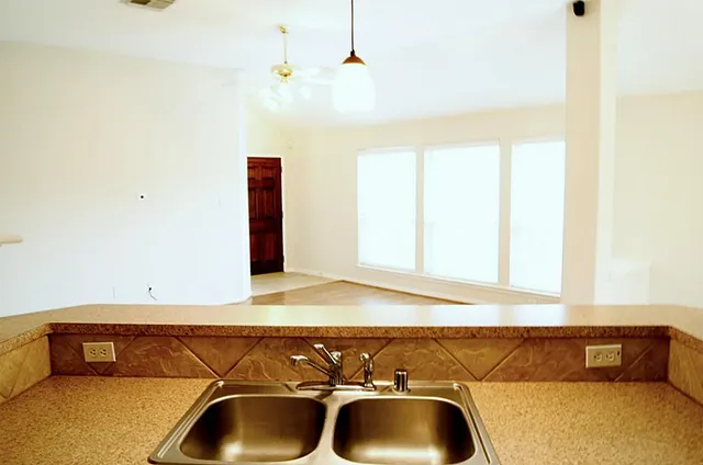 a bathroom with a tub and a sink