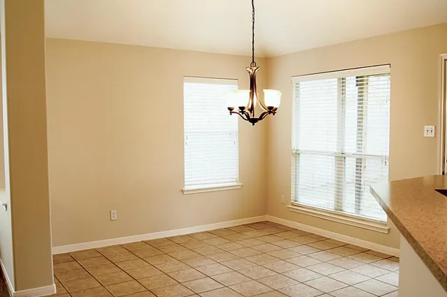 a view of a kitchen with a sink and a fireplace
