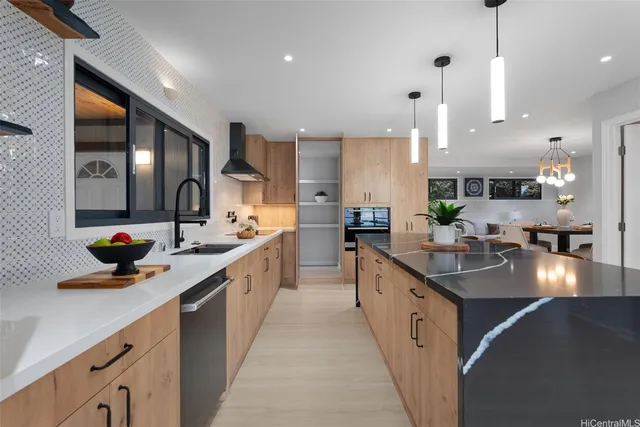 a kitchen with a sink and a refrigerator