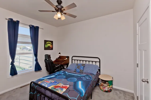 a bedroom with furniture and a window