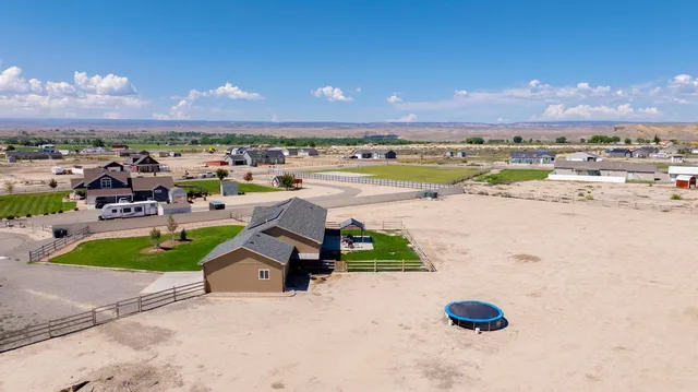 a view of a swimming pool with a yard