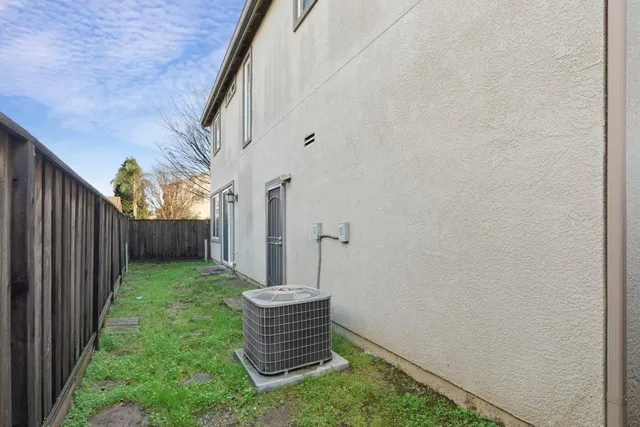 a view of house with backyard