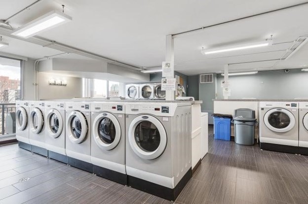 6007 North Sheridan Road, Unit 12D Chicago, IL 60660 - Photo 13 of 13 a utility room with dryer and washer