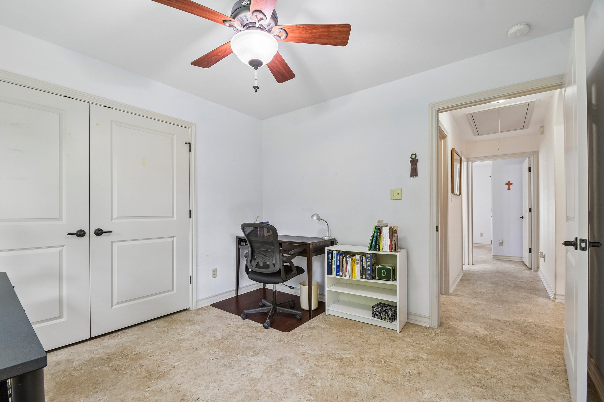 307 West 4th Street Elgin, TX 78621 - Photo 24 of 40 Room featuring a ceiling fan with wood-finish blades, white walls, and light-colored carpet flooring