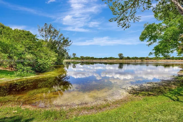 a view of a lake with a yard