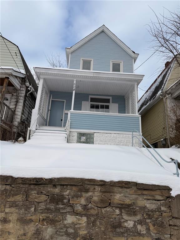 828 Frank Street McKees Rocks, PA 15136 - Photo 1 of 14 a front view of a house