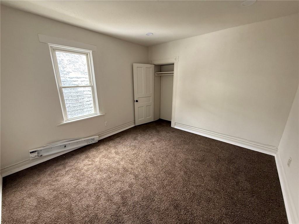 828 Frank Street McKees Rocks, PA 15136 - Photo 9 of 14 an empty room with windows