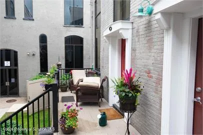 a lobby with furniture and potted plant