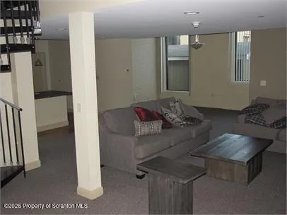 a living room with furniture and a table