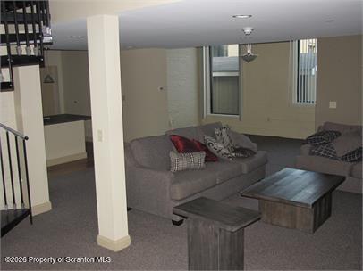 800 James Avenue, Unit 3101 Scranton, PA 18510 - Photo 6 of 7 a living room with furniture and a table