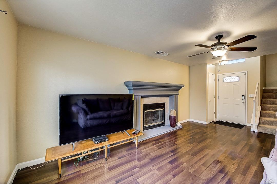 247 Ruby Avenue Richmond, CA 94801 - Photo 1 of 1 a living room with furniture and a fireplace