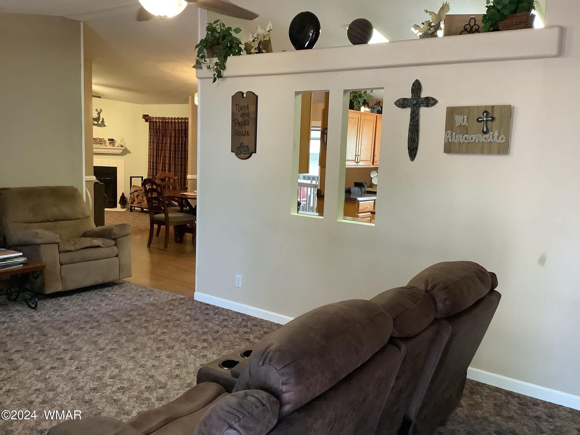 2779 Page Road Overgaard, AZ 85933 - Photo 8 of 35 a living room with furniture and a window