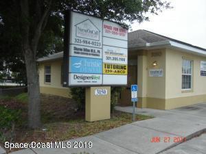 3150 North Wickham Road, Unit 2 Melbourne, FL 32935 - Photo 1 of 7 a sign on the side of a building
