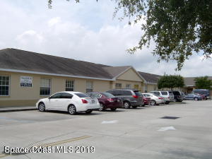 3150 North Wickham Road, Unit 2 Melbourne, FL 32935 - Photo 2 of 7 a car parked in front of a house