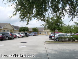 3150 North Wickham Road, Unit 2 Melbourne, FL 32935 - Photo 3 of 7 a view of street with parked cars