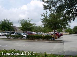 3150 North Wickham Road, Unit 2 Melbourne, FL 32935 - Photo 4 of 7 a car parked on the side of a road