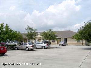 3150 North Wickham Road, Unit 2 Melbourne, FL 32935 - Photo 6 of 7 a view of car parked in front of house