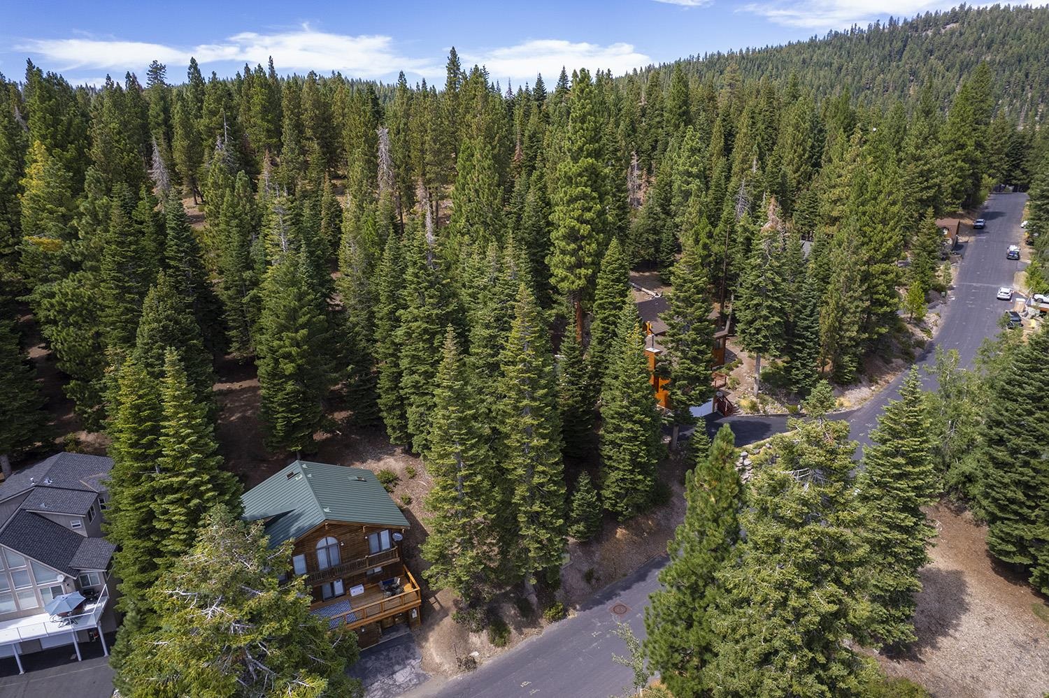 1359 Kings Way Tahoe Vista, CA 96148 - Photo 1 of 23 an aerial view of a city with lots of residential buildings green landscape and mountain view