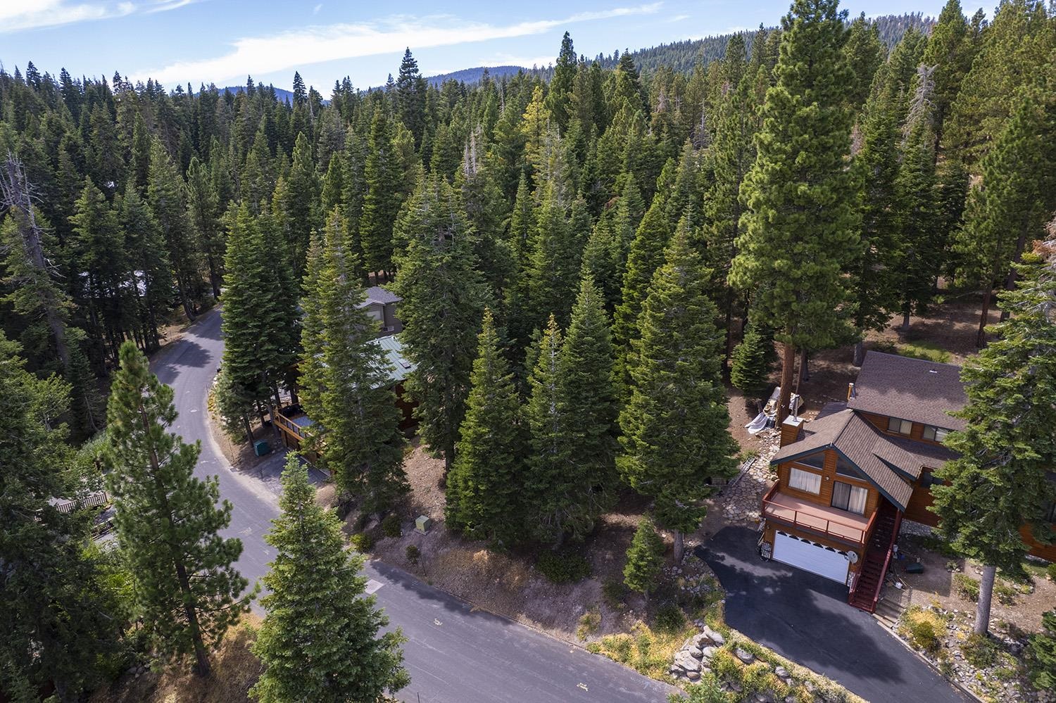 1359 Kings Way Tahoe Vista, CA 96148 - Photo 2 of 23 an aerial view of a house with outdoor space and trees all around