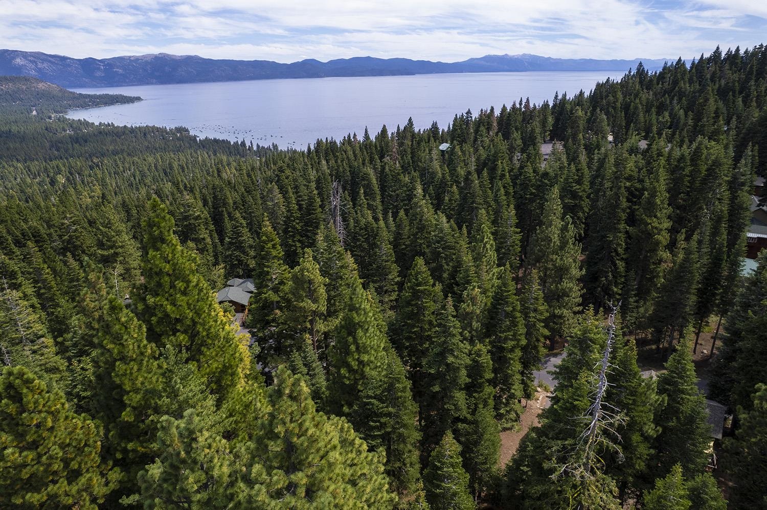 1359 Kings Way Tahoe Vista, CA 96148 - Photo 3 of 23 a view of a lake and green valley