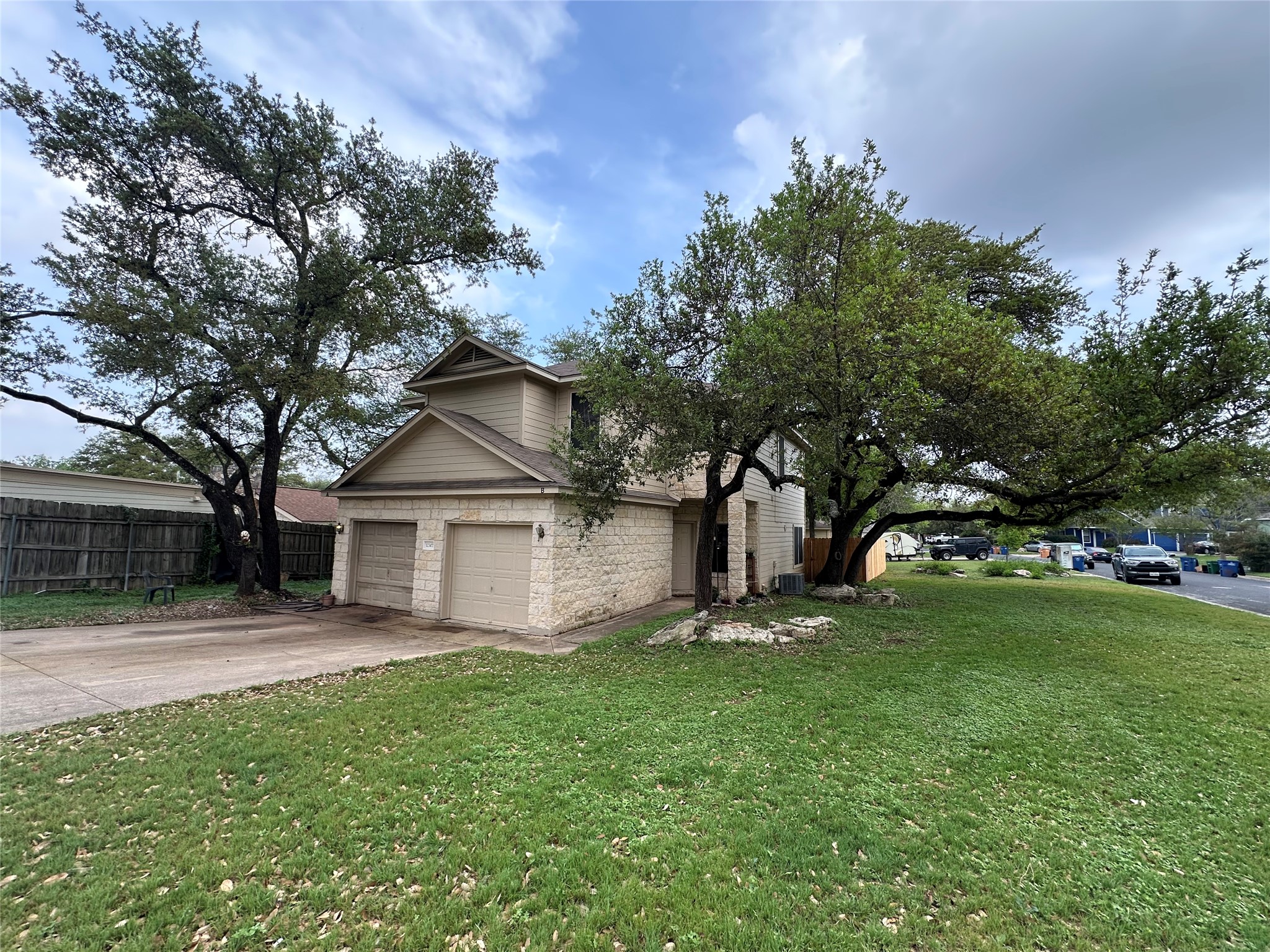 12307 Abney Drive Austin, TX 78729 - Photo 1 of 18 a front view of house with yard and green space