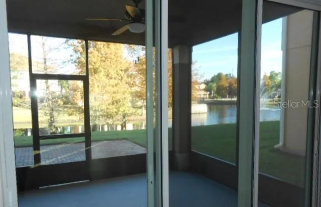 a bathroom with a large window and a bath tub