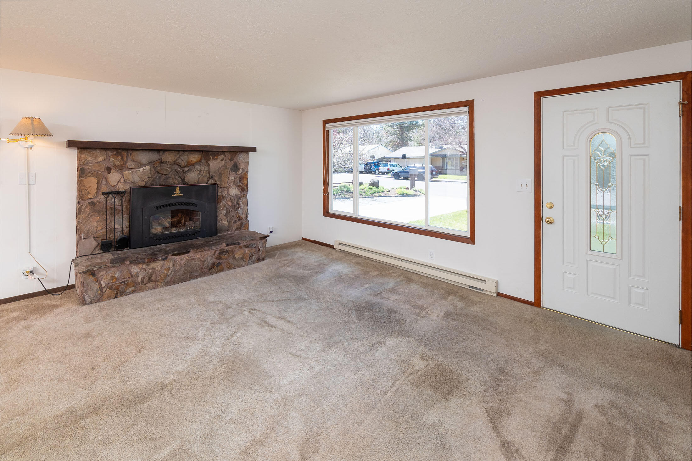 2188 Northeast Shepard Road Bend, OR 97701 - Photo 16 of 52 Living area is light and bright. The newer windows and sliding glass door are so nice.