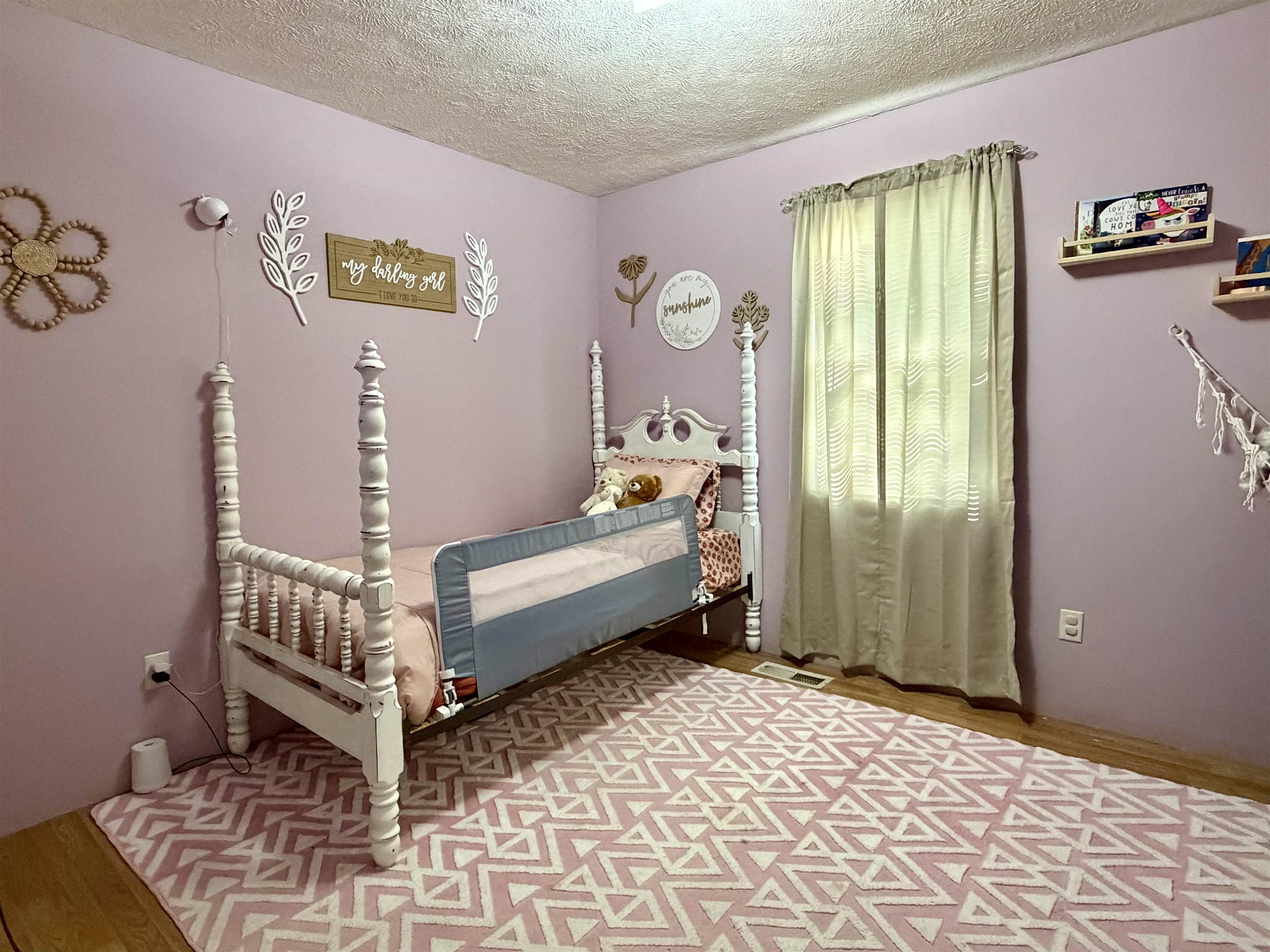 1536 Robinson Shed Road Bethel Springs, TN 38315 - Photo 17 of 23 Room with wood-finish flooring and a window with light-filtering curtains
