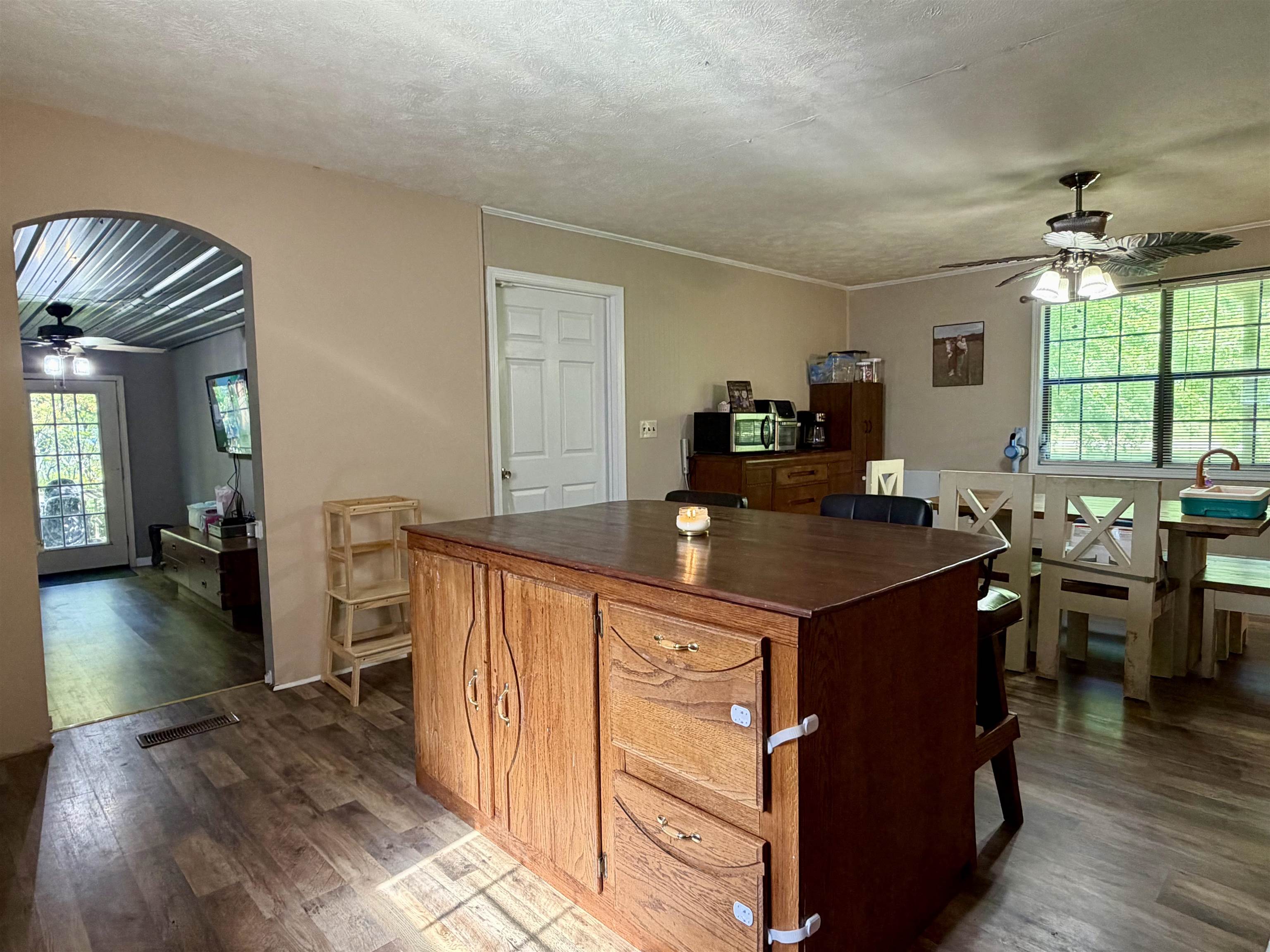 1536 Robinson Shed Road Bethel Springs, TN 38315 - Photo 8 of 23 Spacious kitchen featuring wood-finish flooring and a central island with storage cabinetry
