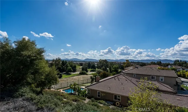 a aerial view of a house with a yard and outdoor seating