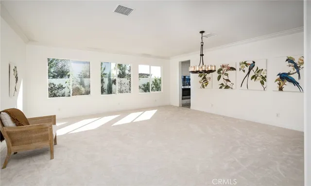a view of a livingroom with furniture and a ceiling fan