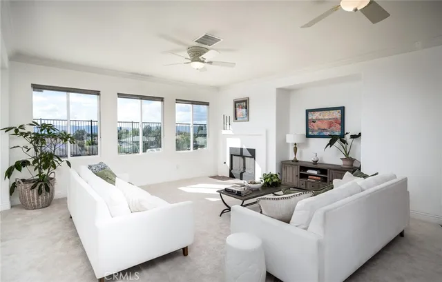 a view of a room that has a window and wooden floor