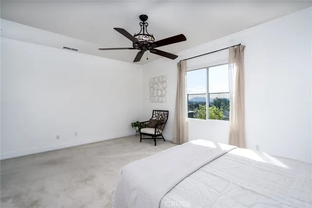 a view of a house with backyard porch and sitting area