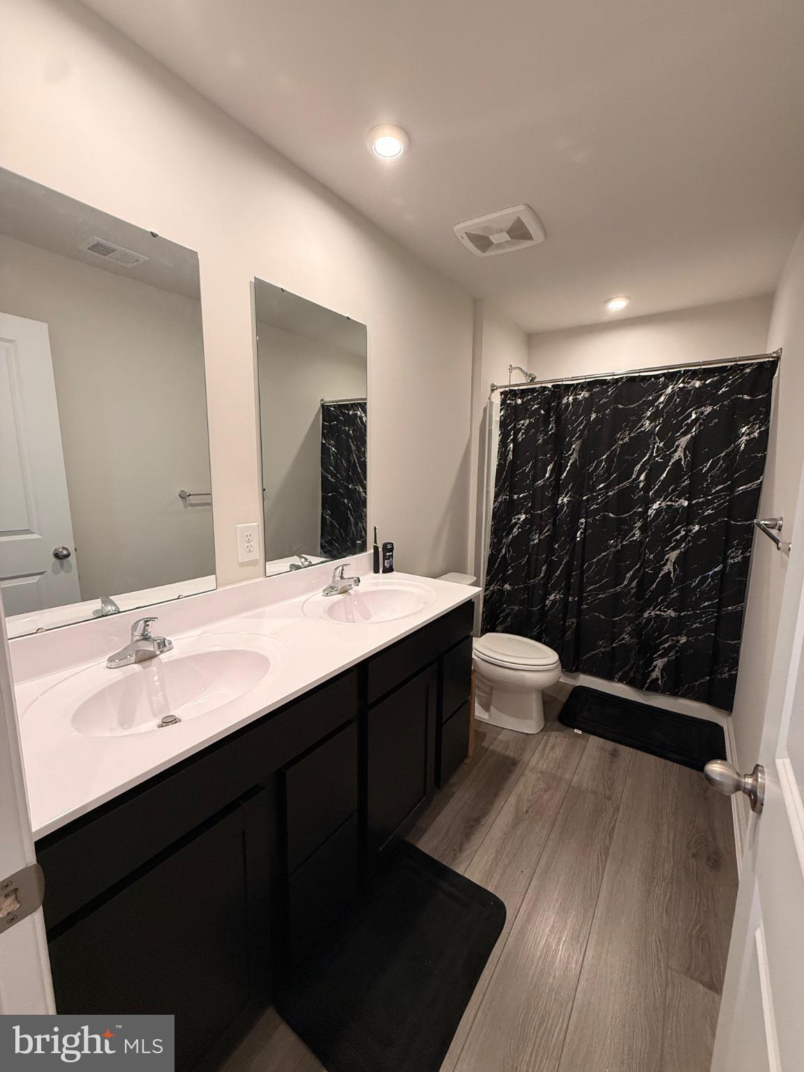 73 Gypsum Road Dover, DE 19904 - Photo 22 of 30 Sleek modern bathroom with dual sinks.