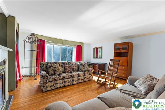 a living room with furniture fireplace and a flat screen tv
