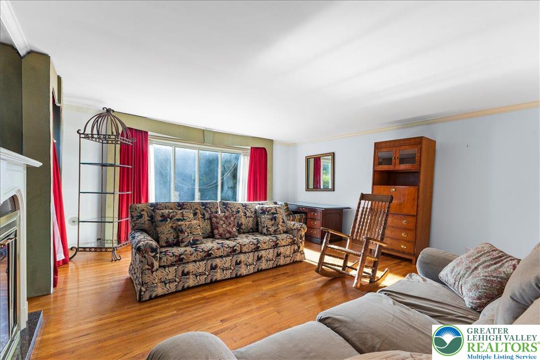 1331 Armstrong Road Bethlehem, PA 18017 - Photo 12 of 28 a living room with furniture fireplace and a flat screen tv