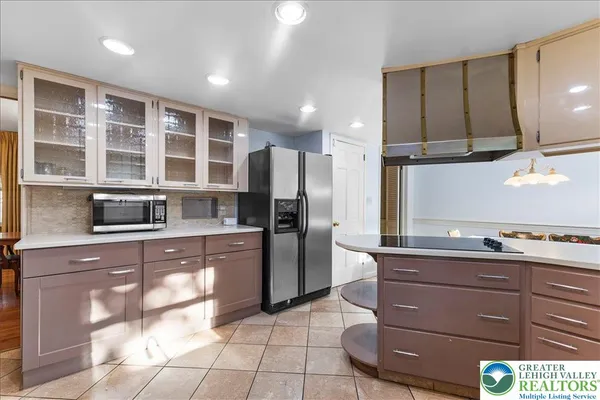 a kitchen with a refrigerator and a sink
