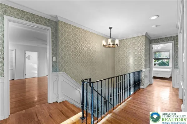 a view of a hallway view with floor to ceiling window and wooden floor